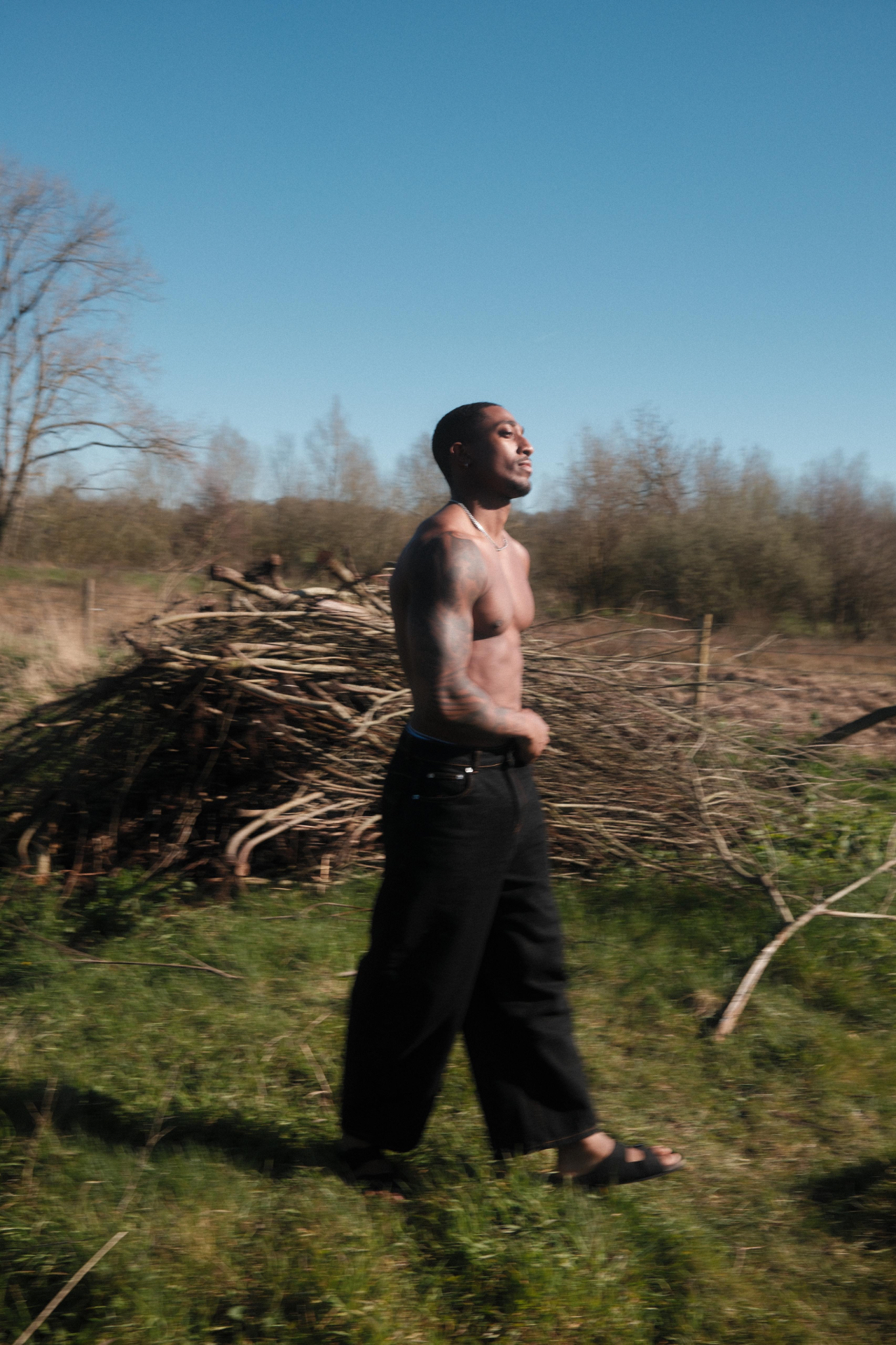Figure walking through open field